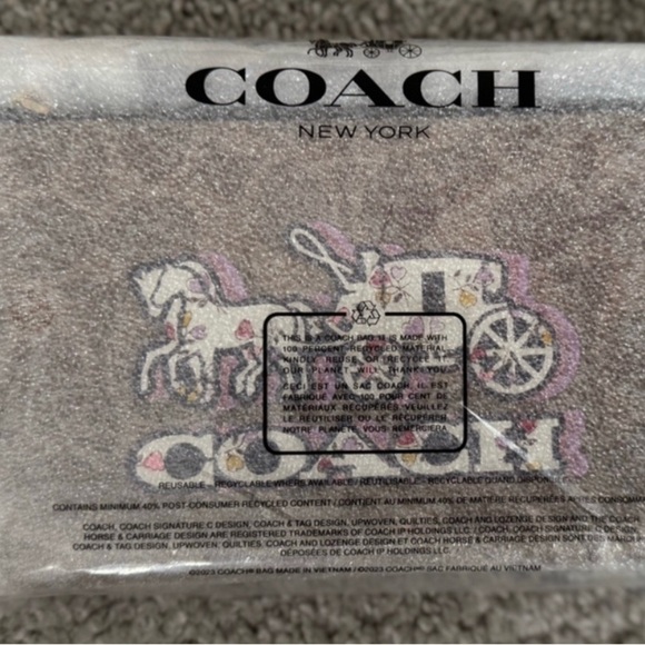 Coach Corner Zip Wristlet In
Signature Canvas With Horse And Carriage Print